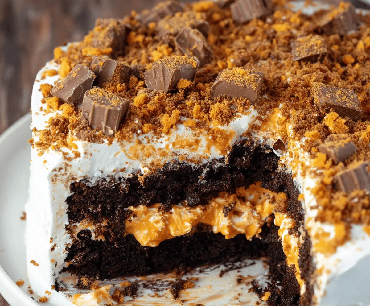 Delicious Butterfinger Cake with layered chocolate and peanut butter frosting